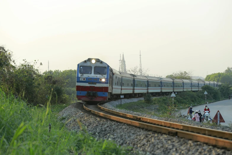 a train that is on the tracks in the day