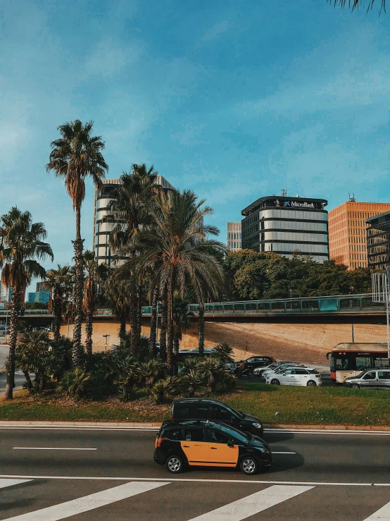 a small black car in the middle of the street