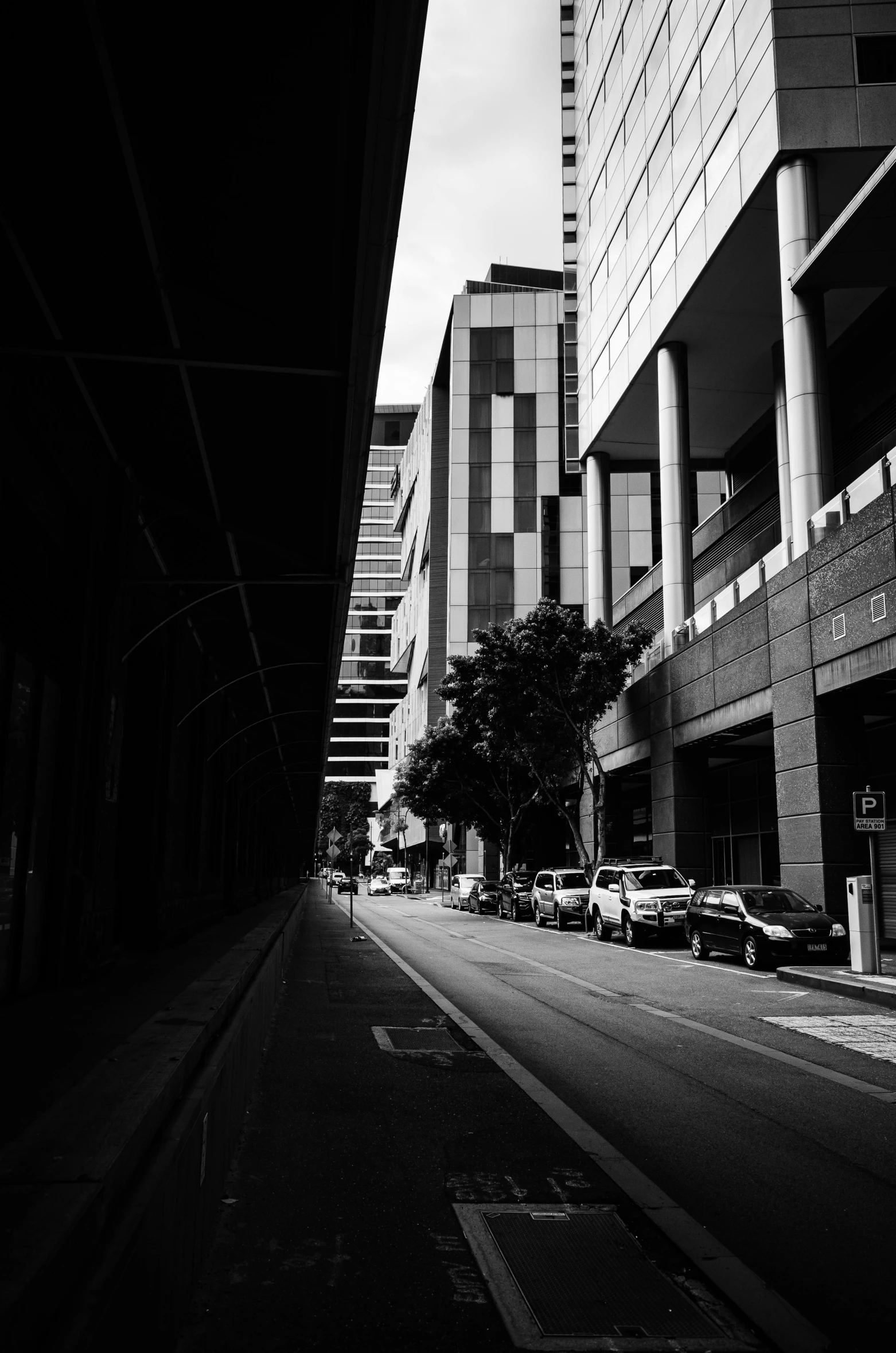 a city street is lined with cars on it