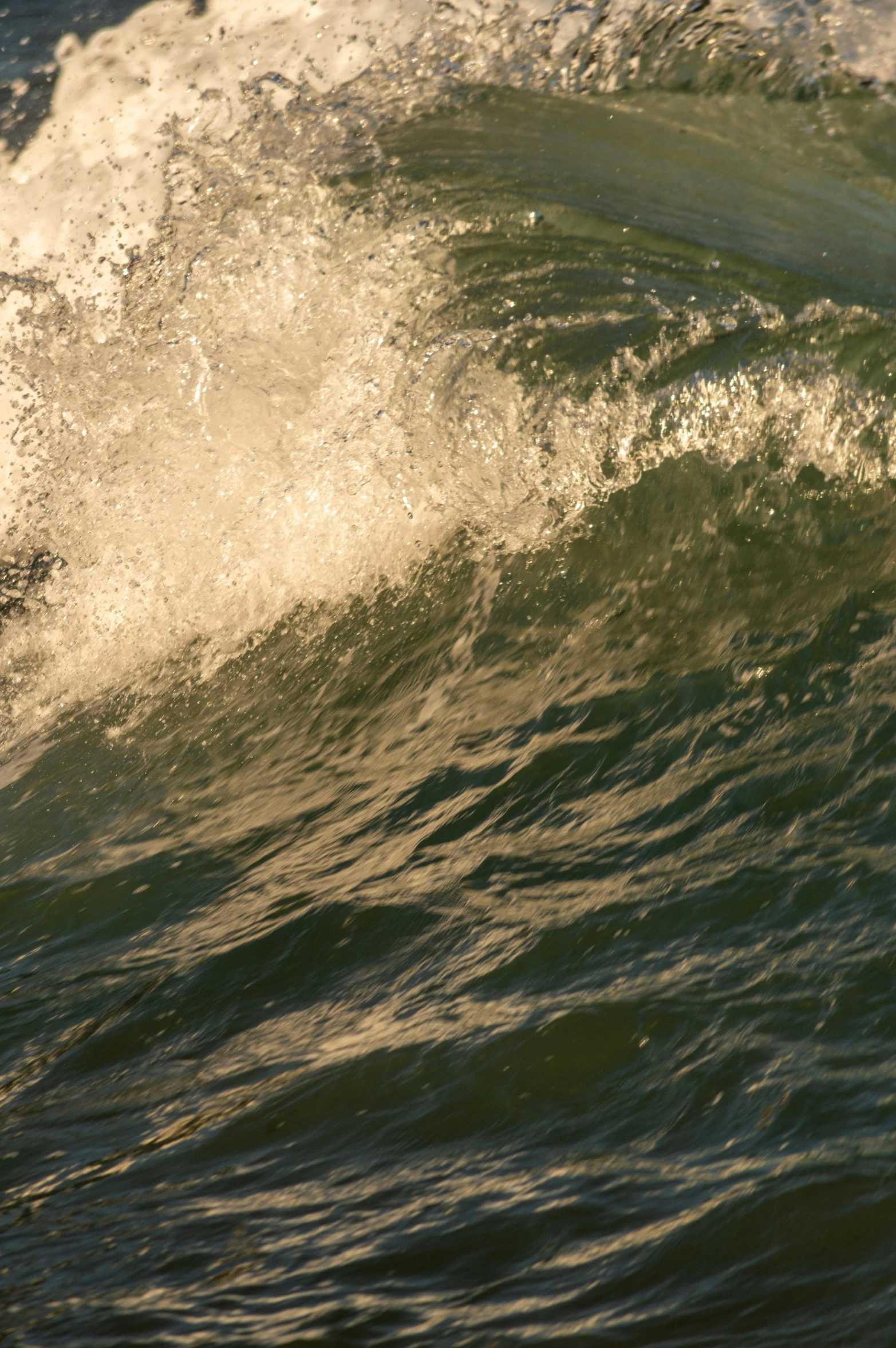 a man riding on top of a wave in the ocean