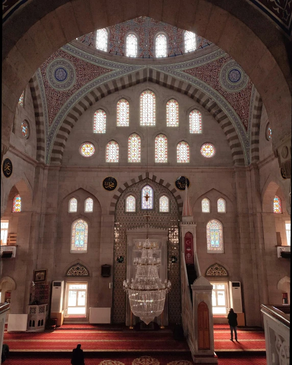 an elaborate building is shown with an arch