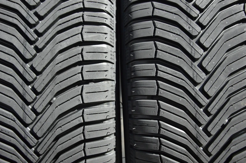 two tire rims that are parked close together