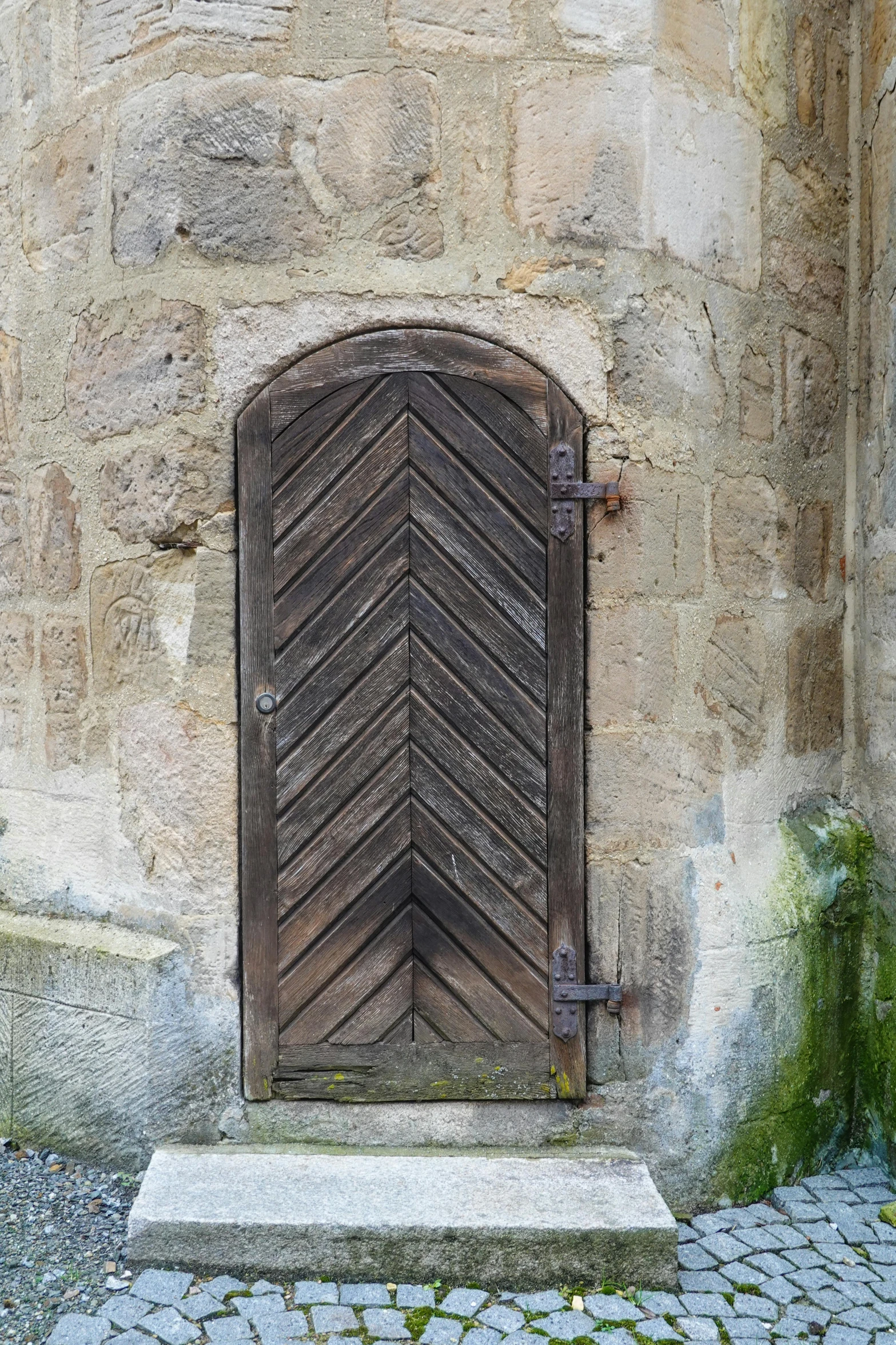 a large door to a building with a large wood door