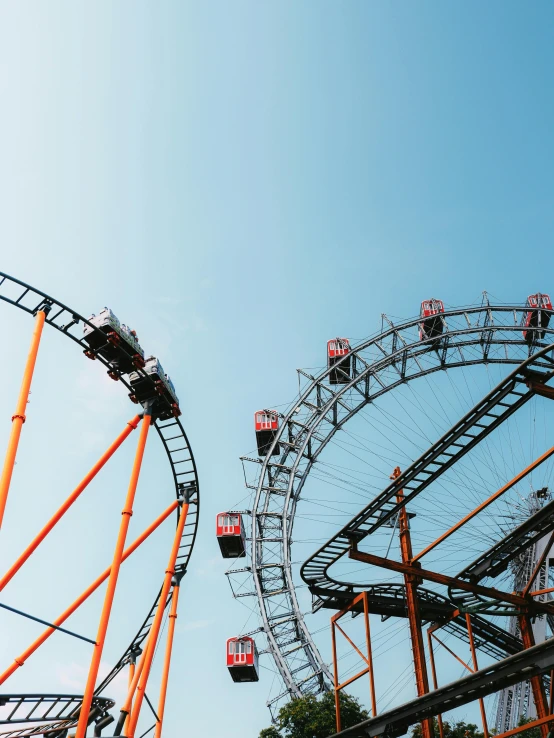 an abandoned carnival ride and a large ferris wheel