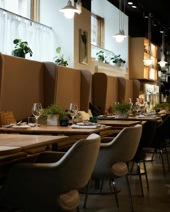 tables and chairs are arranged in the dining area of a restaurant