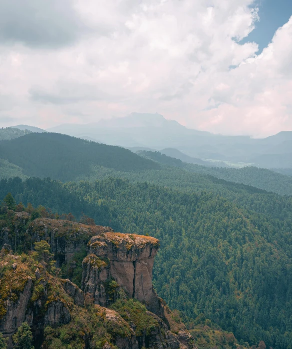 a scenic view from the top of a mountain looking down at a valley