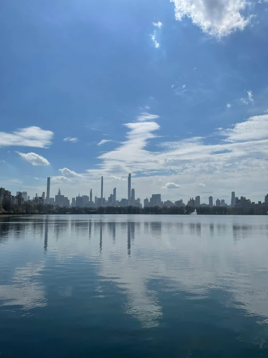 a city skyline is shown with some buildings on the other side of the water