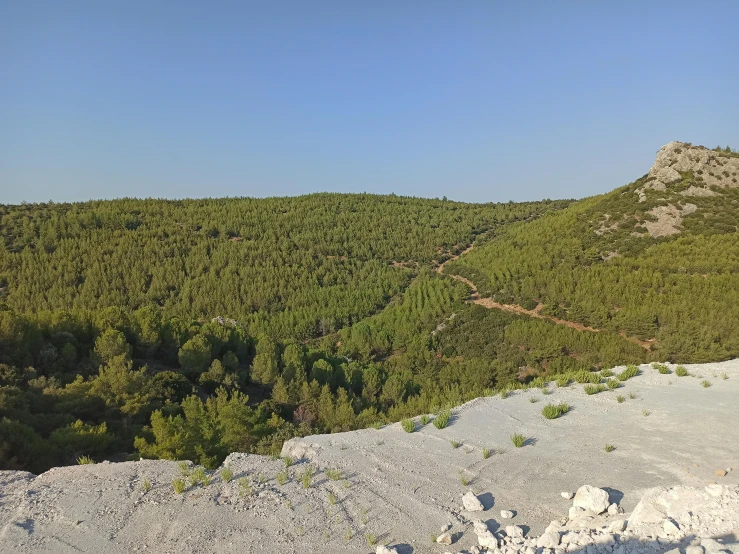 a view of mountains from a rocky overlook