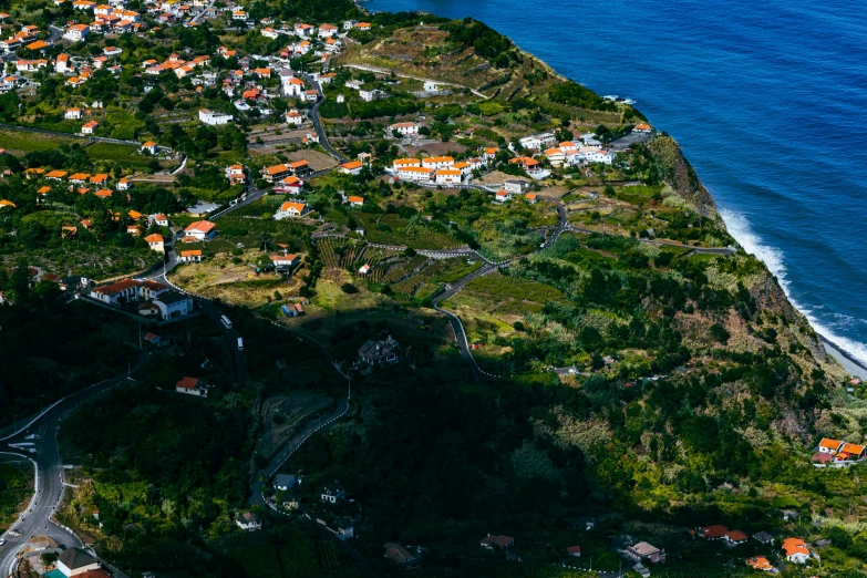 an aerial view of a hilly area with some houses next to it