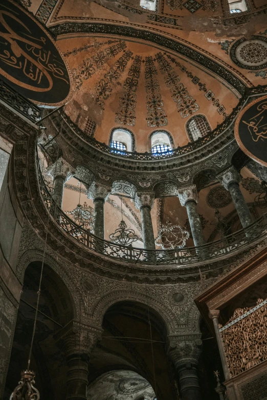 the interior of an ornate building with multiple arches