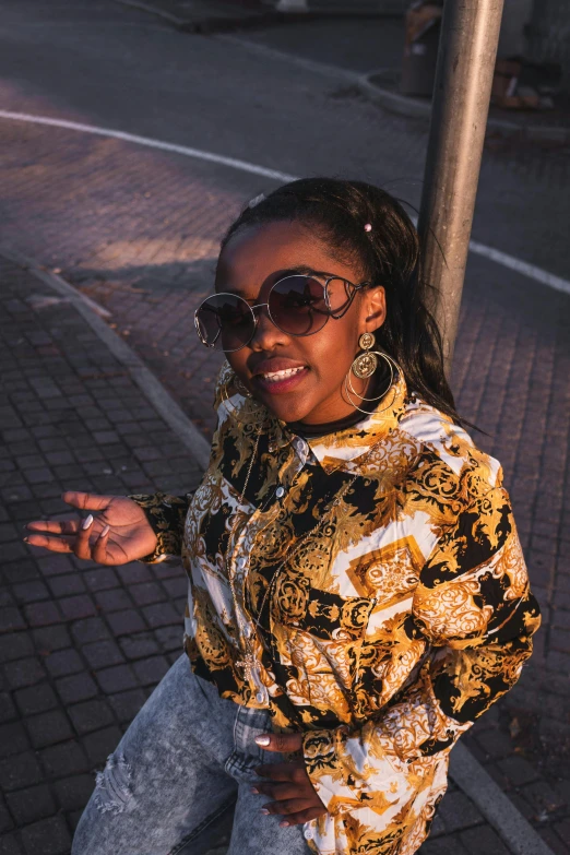 a woman with long dark hair and sunglasses on