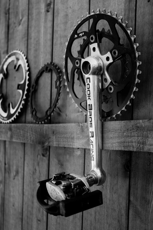 bicycle gear hanging on a barn wall