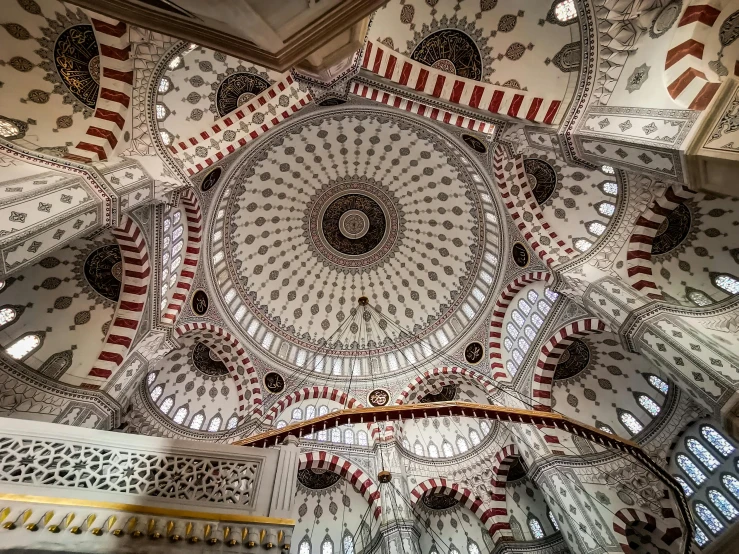 the intricate ceiling inside an elaborately designed building