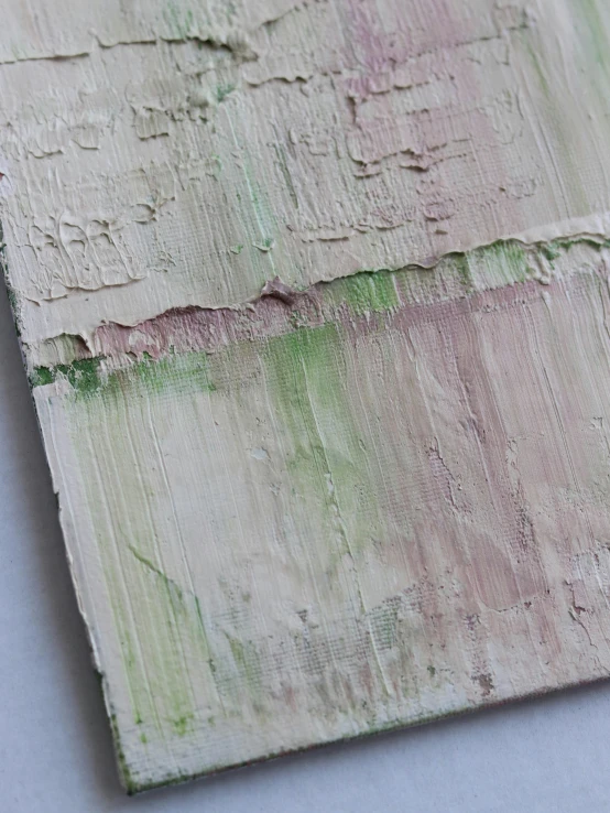 green and brown textured paper next to white background