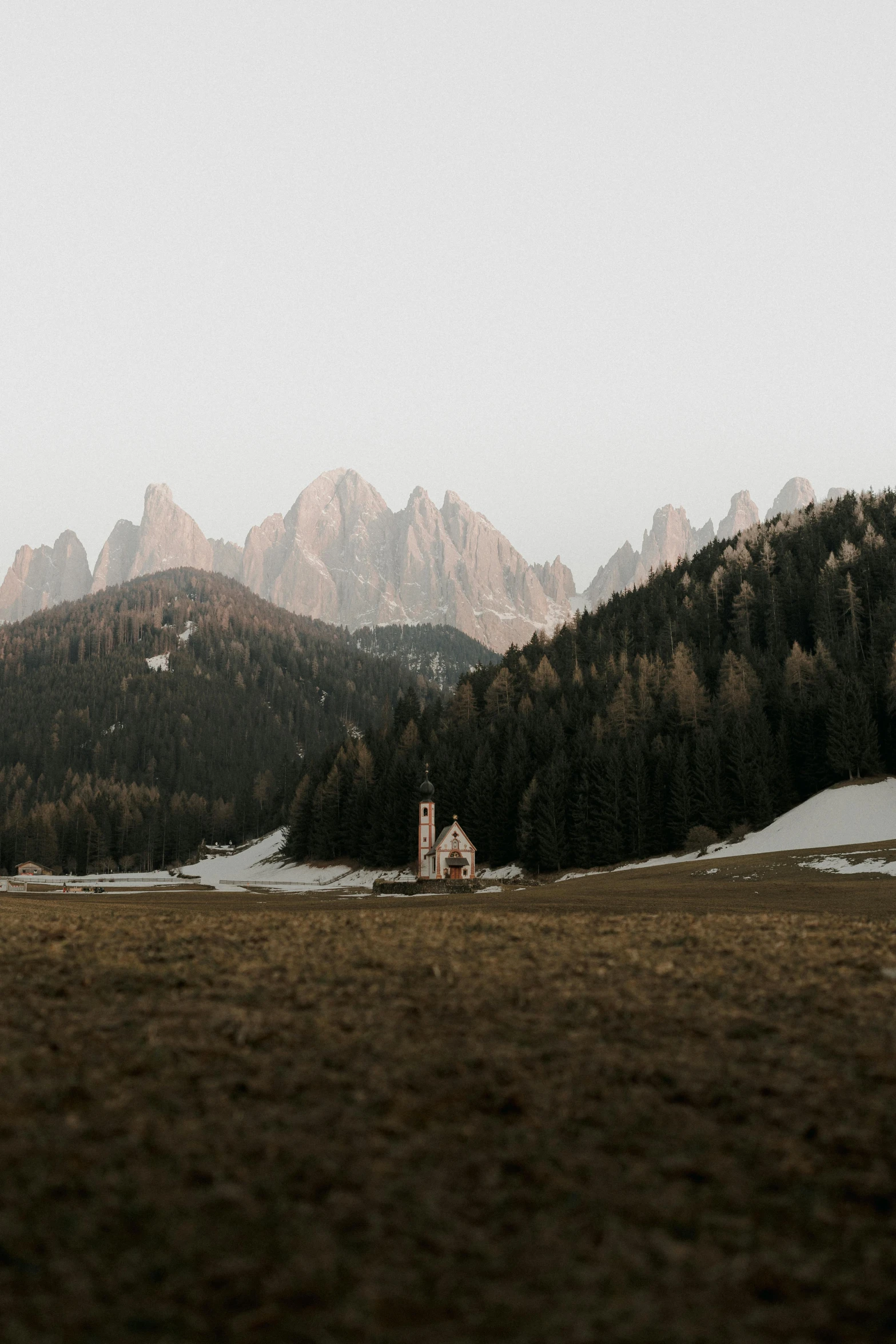 a large mountain range covered in lots of snow