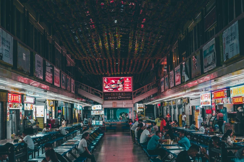 the inside of a restaurant with several tables and benches