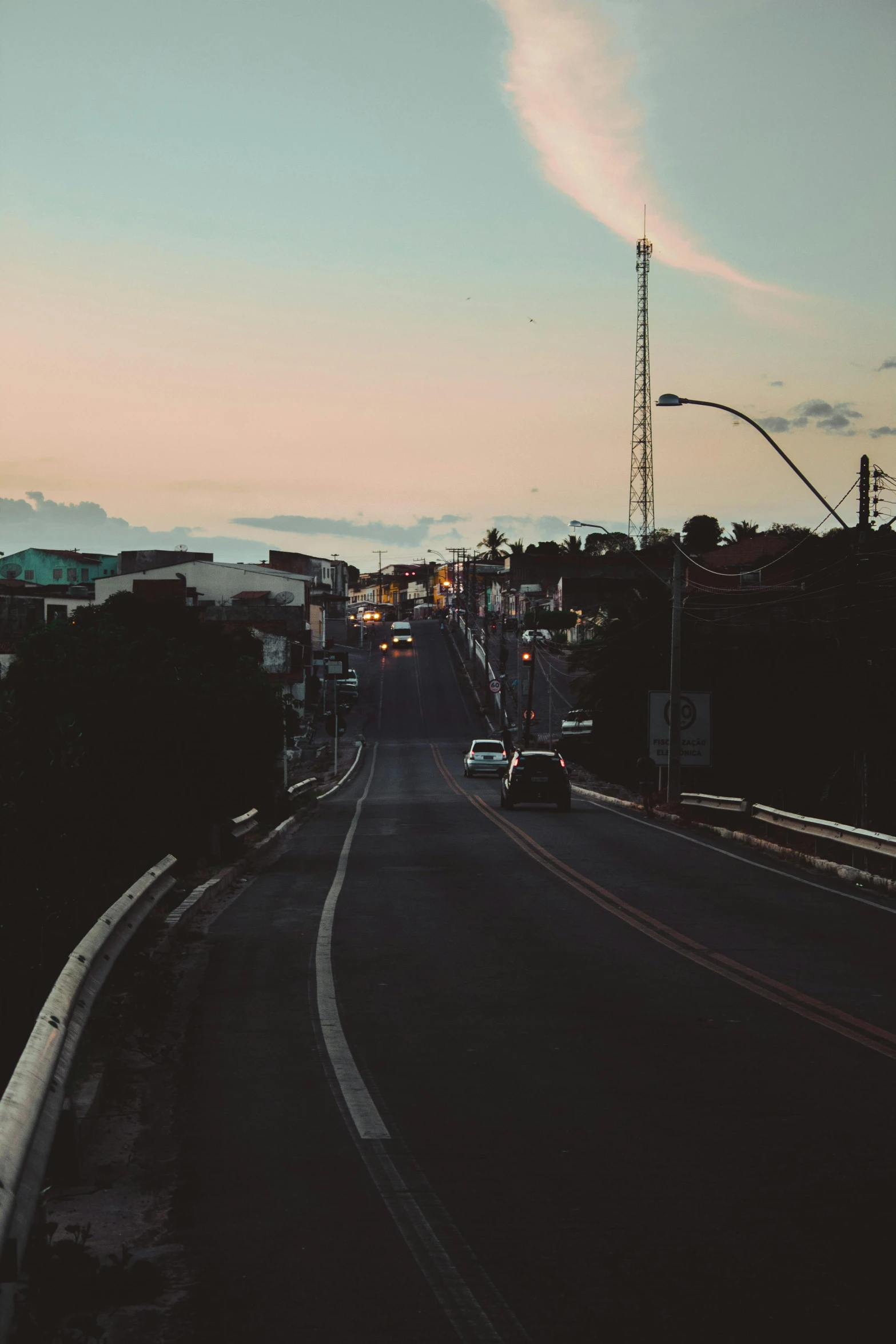 a car is driving down a city street