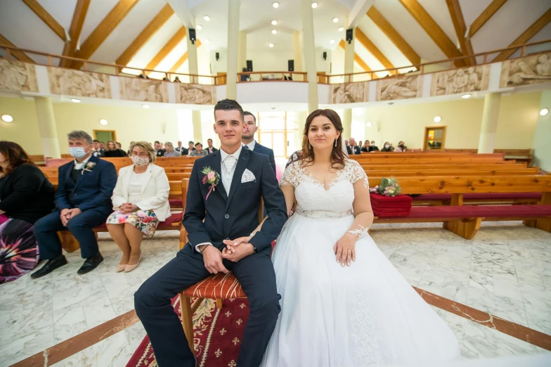 a bride and groom are in the alter