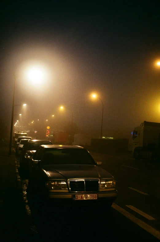 a street filled with lots of traffic at night