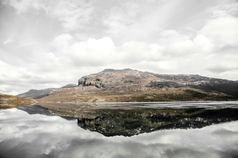 a mountain range and the water reflecting it