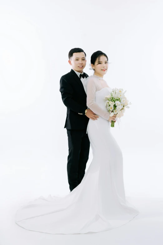 young beautiful bride and groom posing for portrait