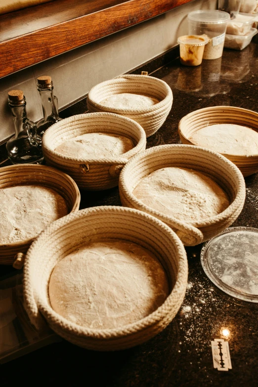 baskets sit on the counter next to some containers