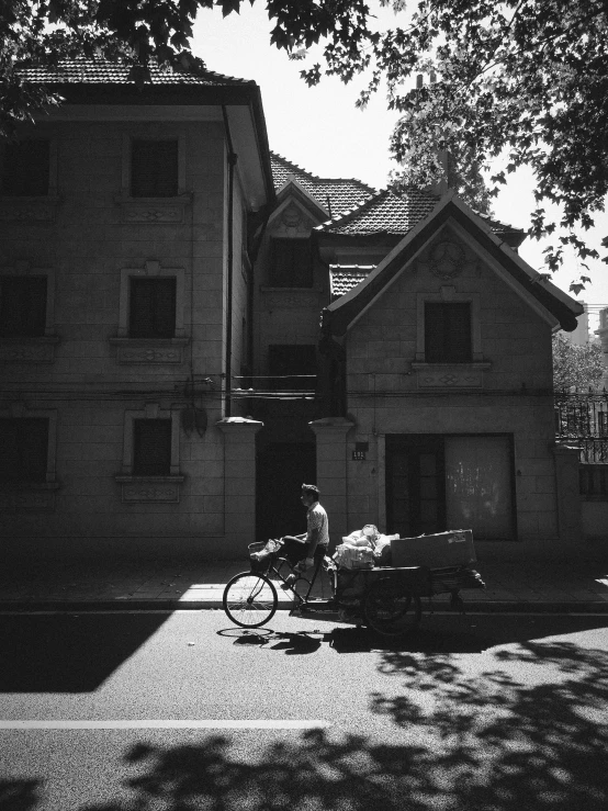 a black and white po with a person sitting on a bicycle