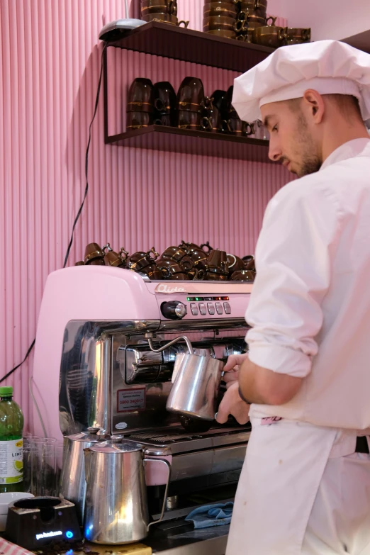 a man in an oven preparing food and drinks