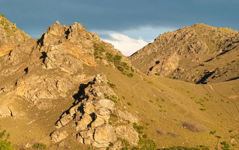 some very tall mountain tops in the sky