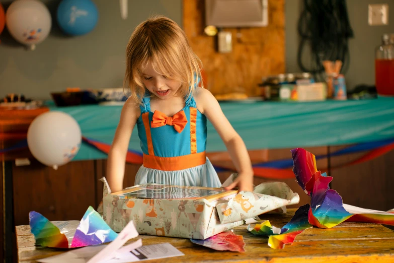 a  standing by a box with paper airplanes in it