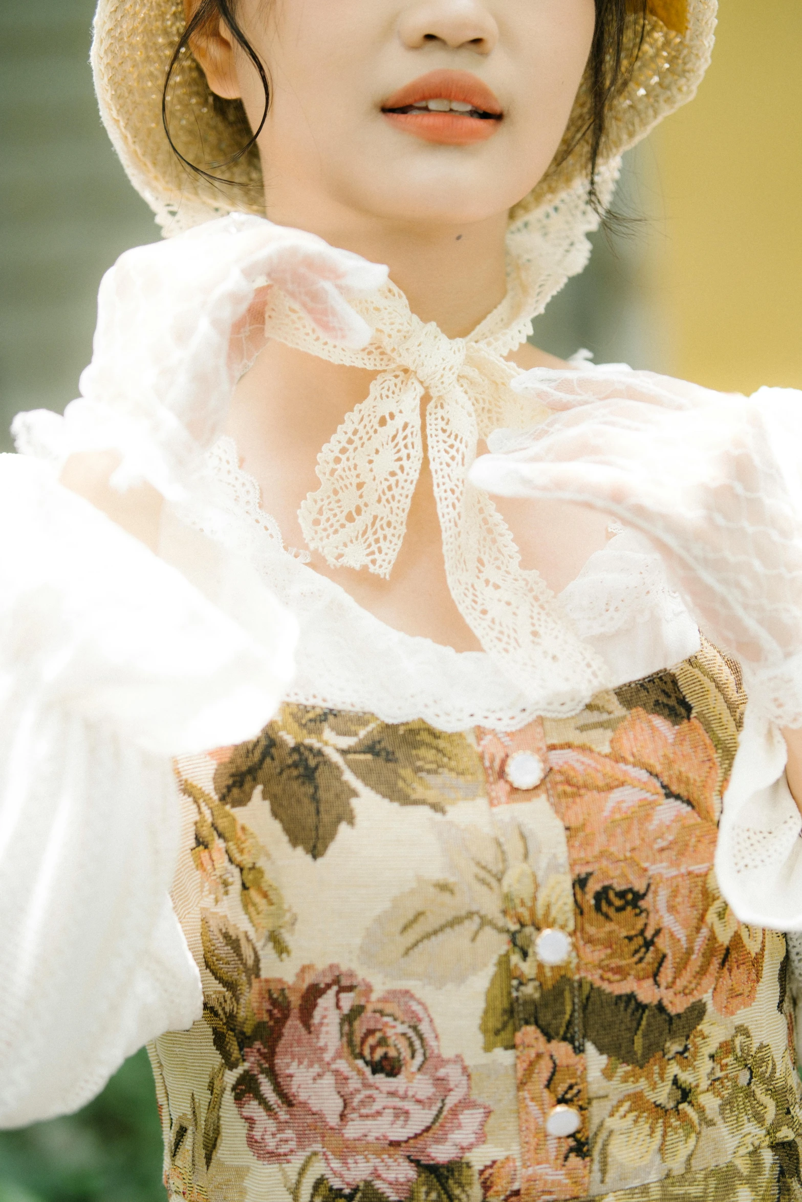 a young woman with long hair wearing a flowered dress