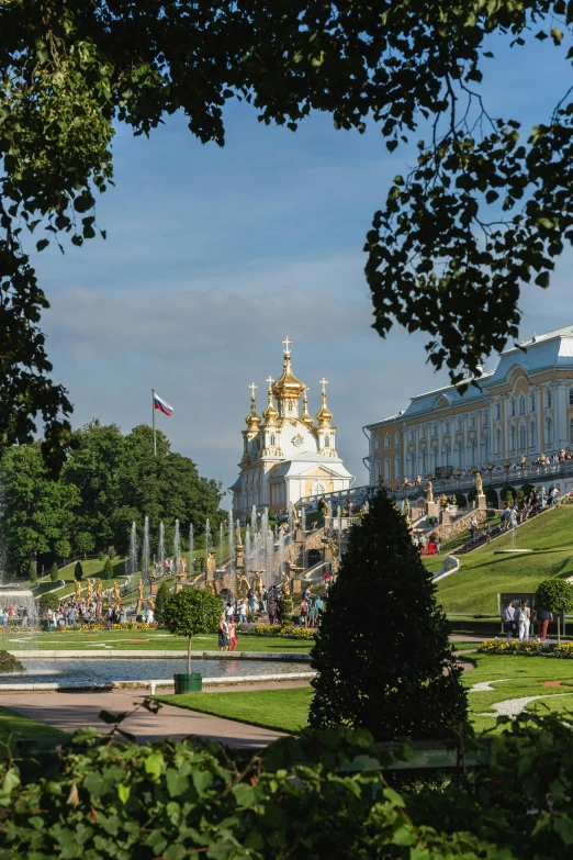 a large building in the middle of some trees and shrubs