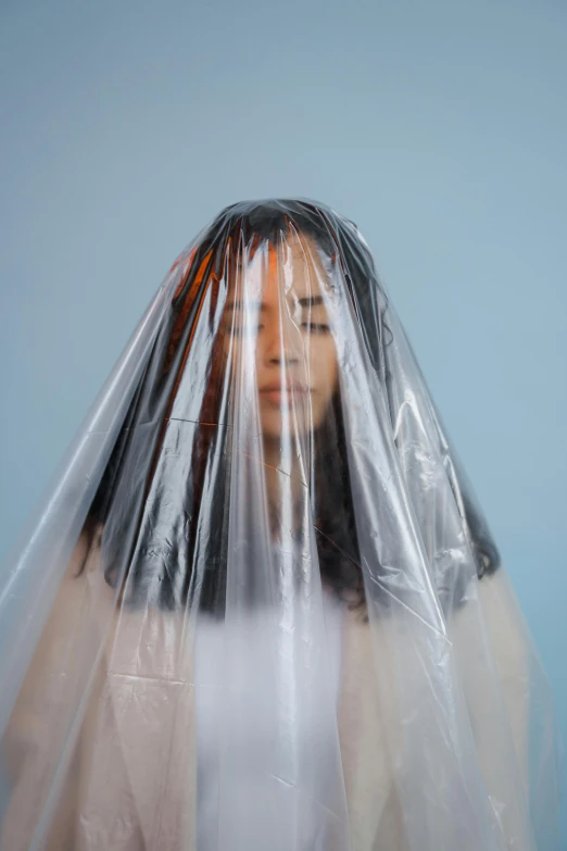 a woman wrapped up in plastic for a po shoot