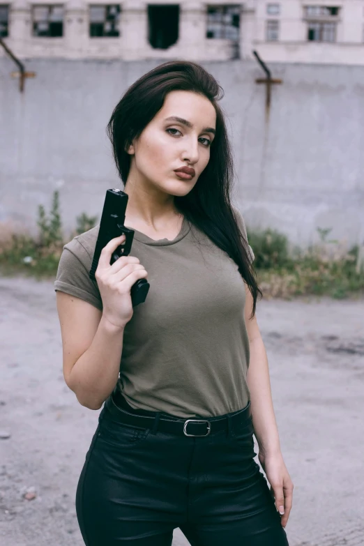 a woman with long hair posing in a grungy po