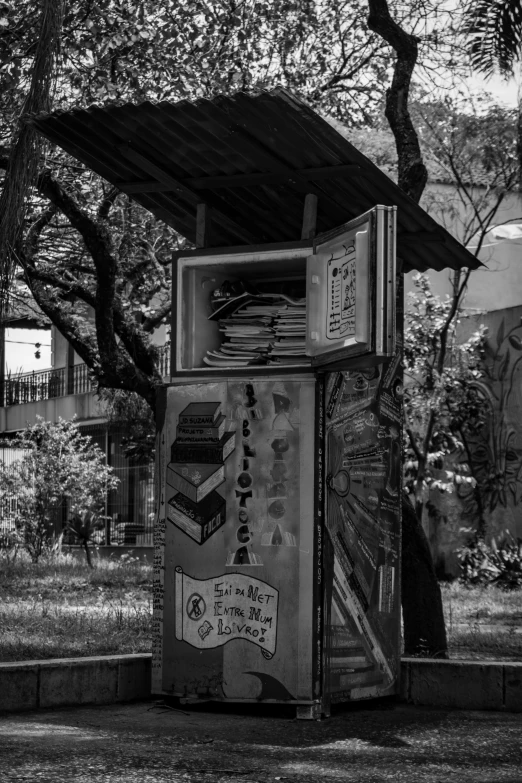 a small portable toilet with various signs on it