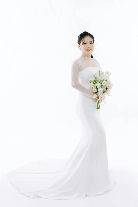 woman in wedding dress standing in white background