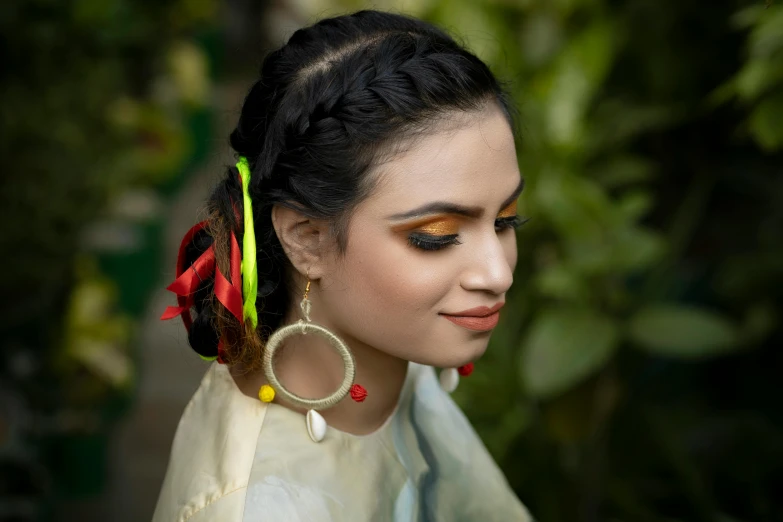 a woman with brown eyes and yellow makeup