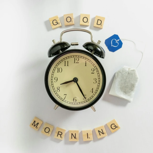 an alarm clock with the words good morning and some type of rubber blocks around it