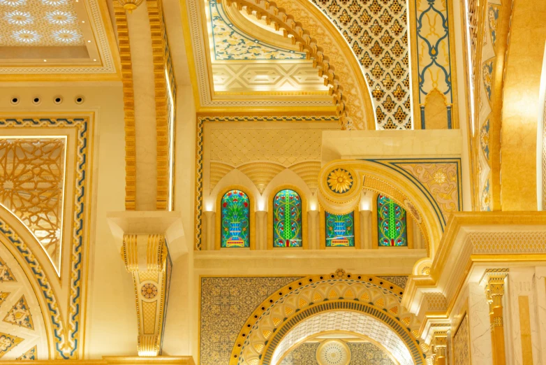 the inside of a building with arches, archways and stained glass