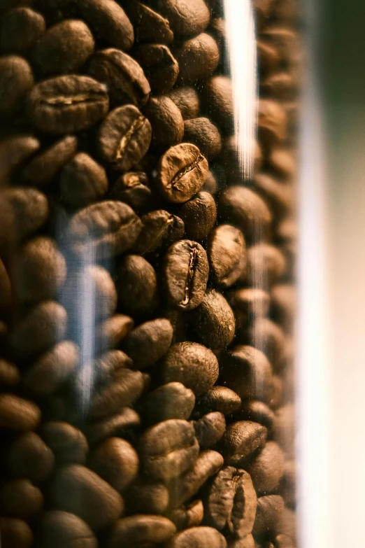 closeup of grains with a glass container in the background