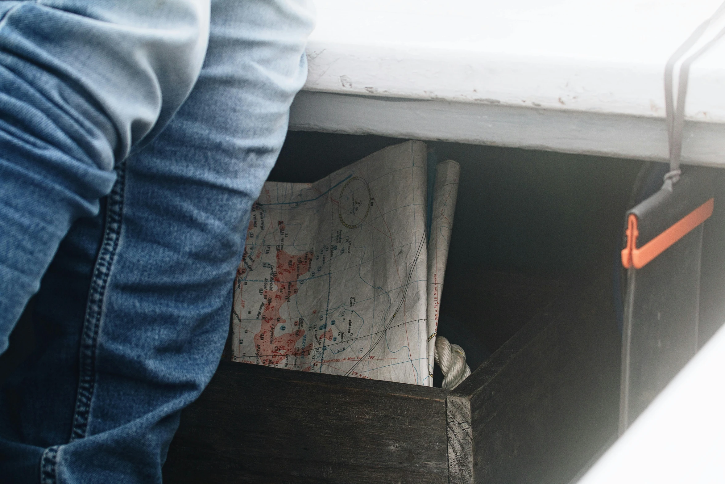 a person with their feet resting in the ground and holding soing