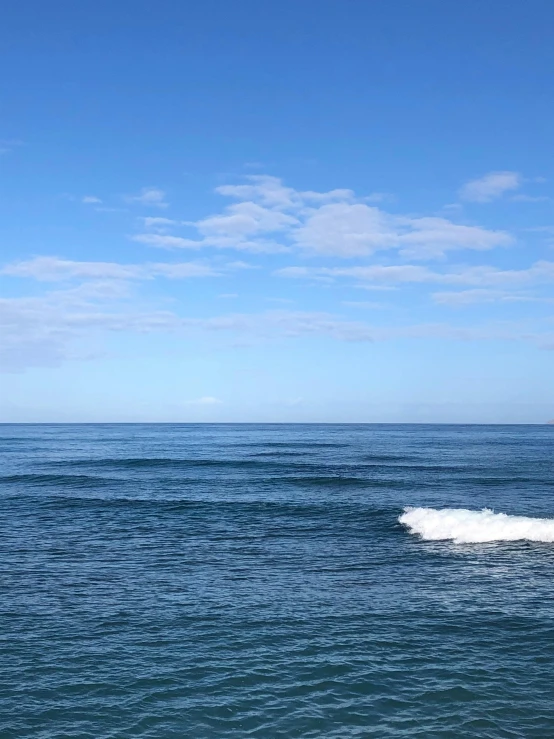 two people on boards in the middle of the water