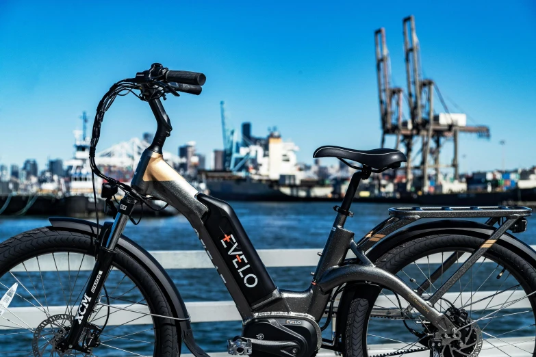 an electric bike parked near a body of water