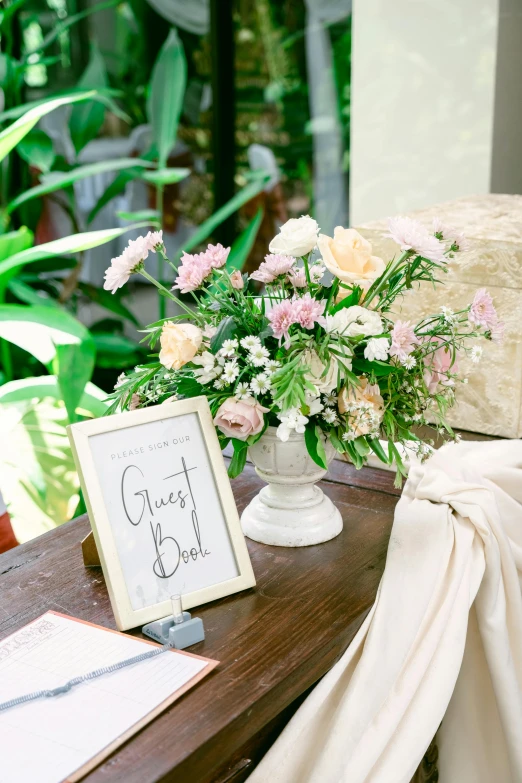 flowers are sitting on top of a wooden table