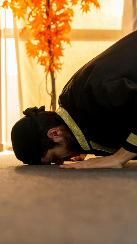 a man that is on the ground with a tie