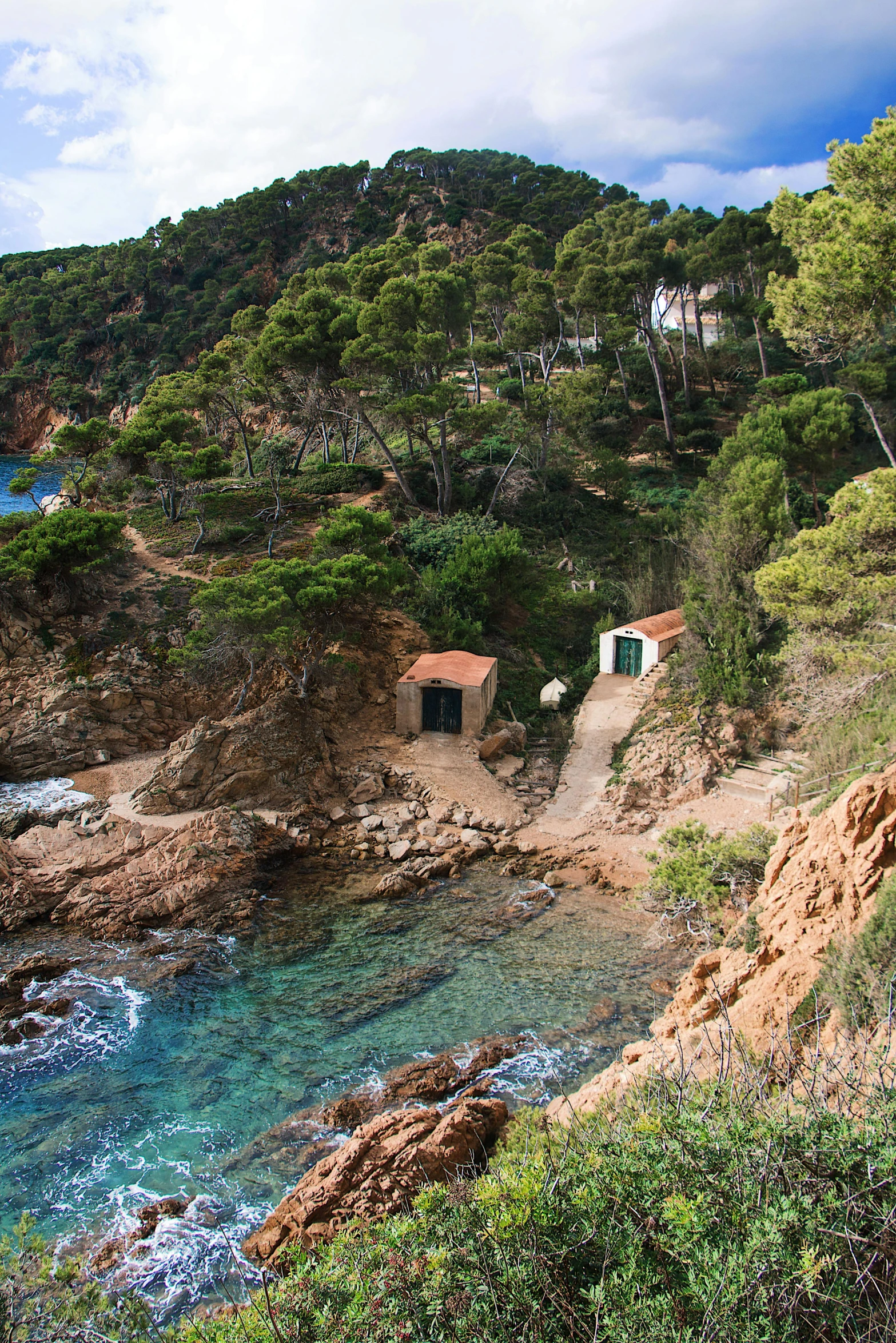 the view of a house is near the water