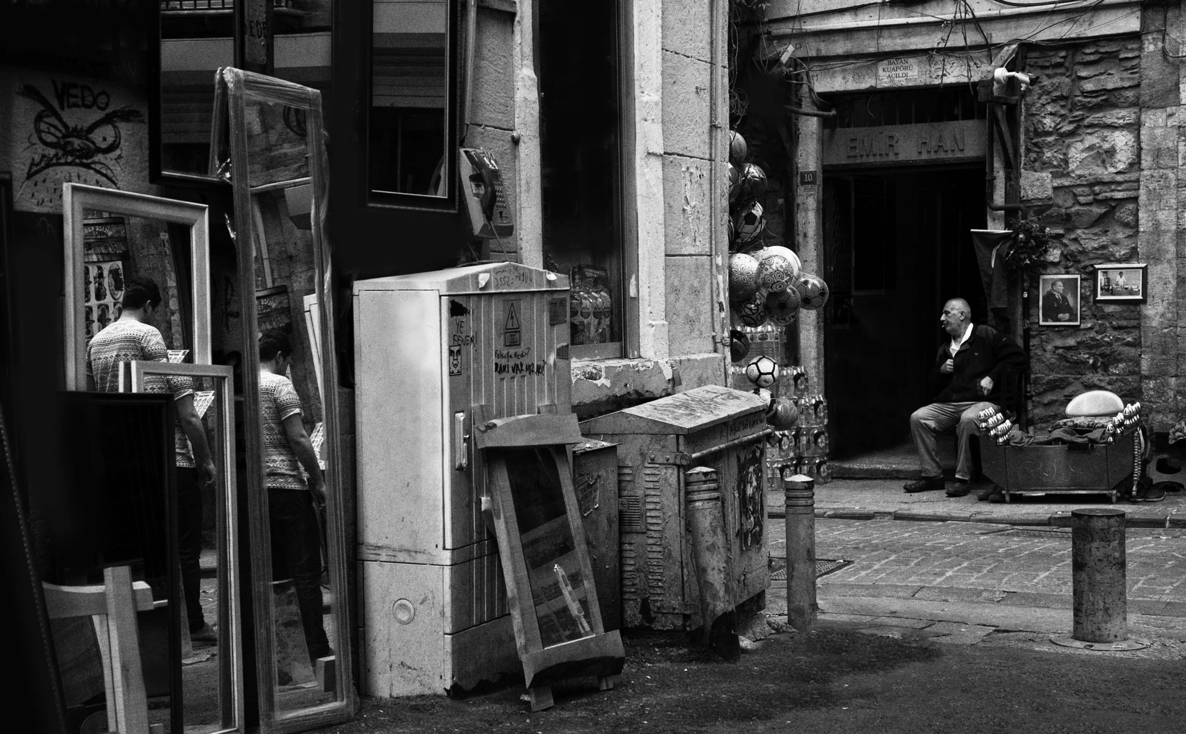 two men look inside of an industrial window