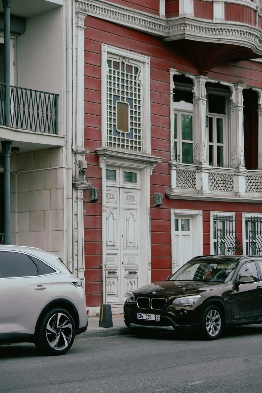 two cars parked next to each other on the street