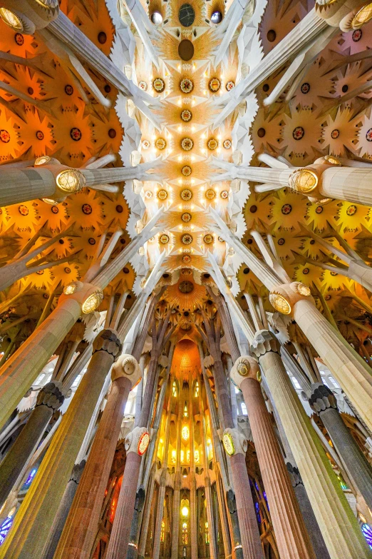 the ceiling of a church with several colorful pillars