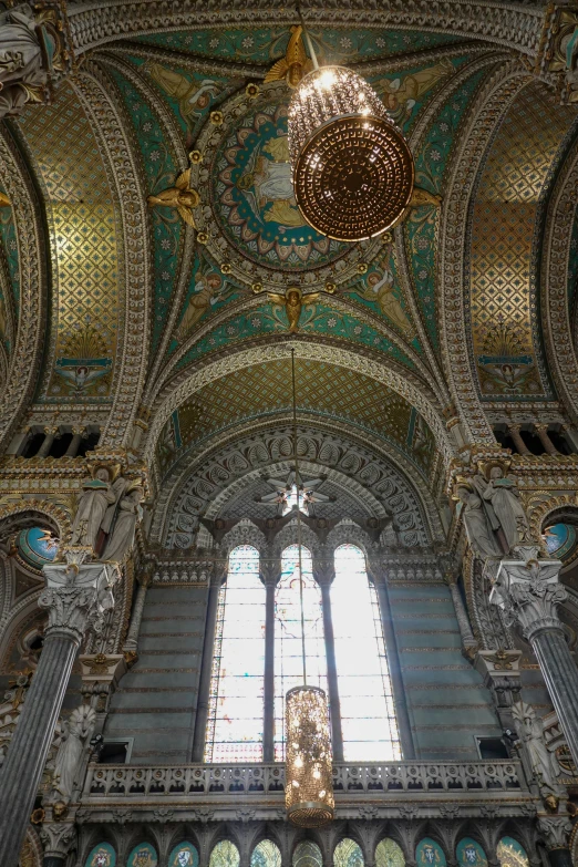 an ornate building with two large windows and a domed ceiling